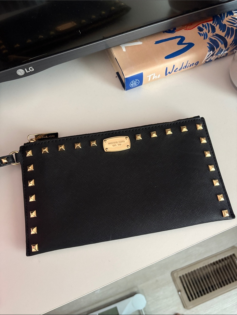 Michael Kors Black Wristlet with Gold Pyramid Studs